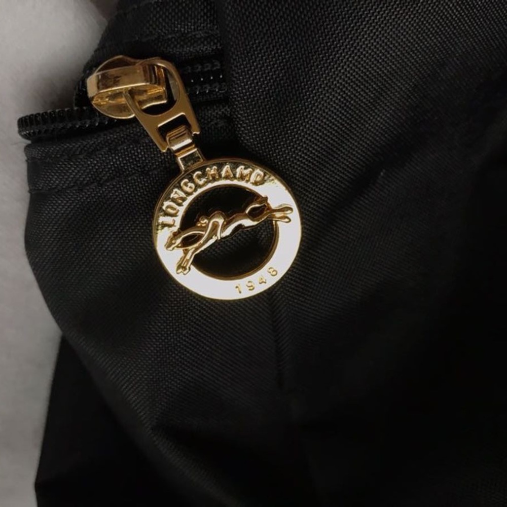 A black long champ backpack